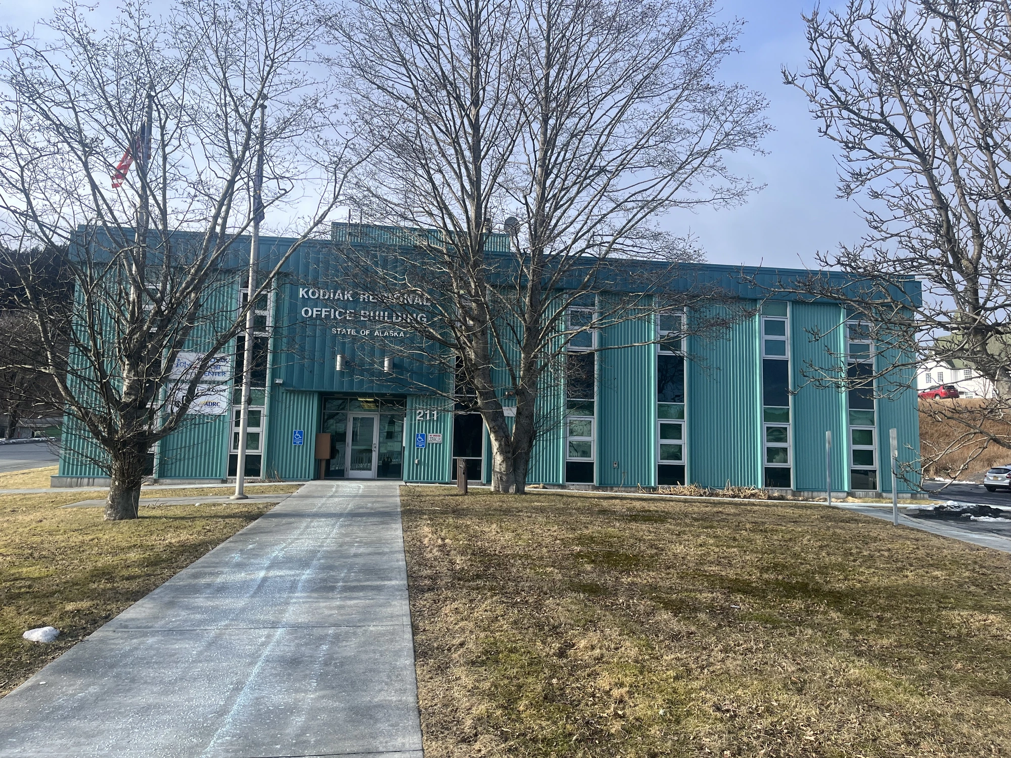 The Kodaik office for ILC, a teal building with a sign that reads 'Kodiak Regional Office Building'.