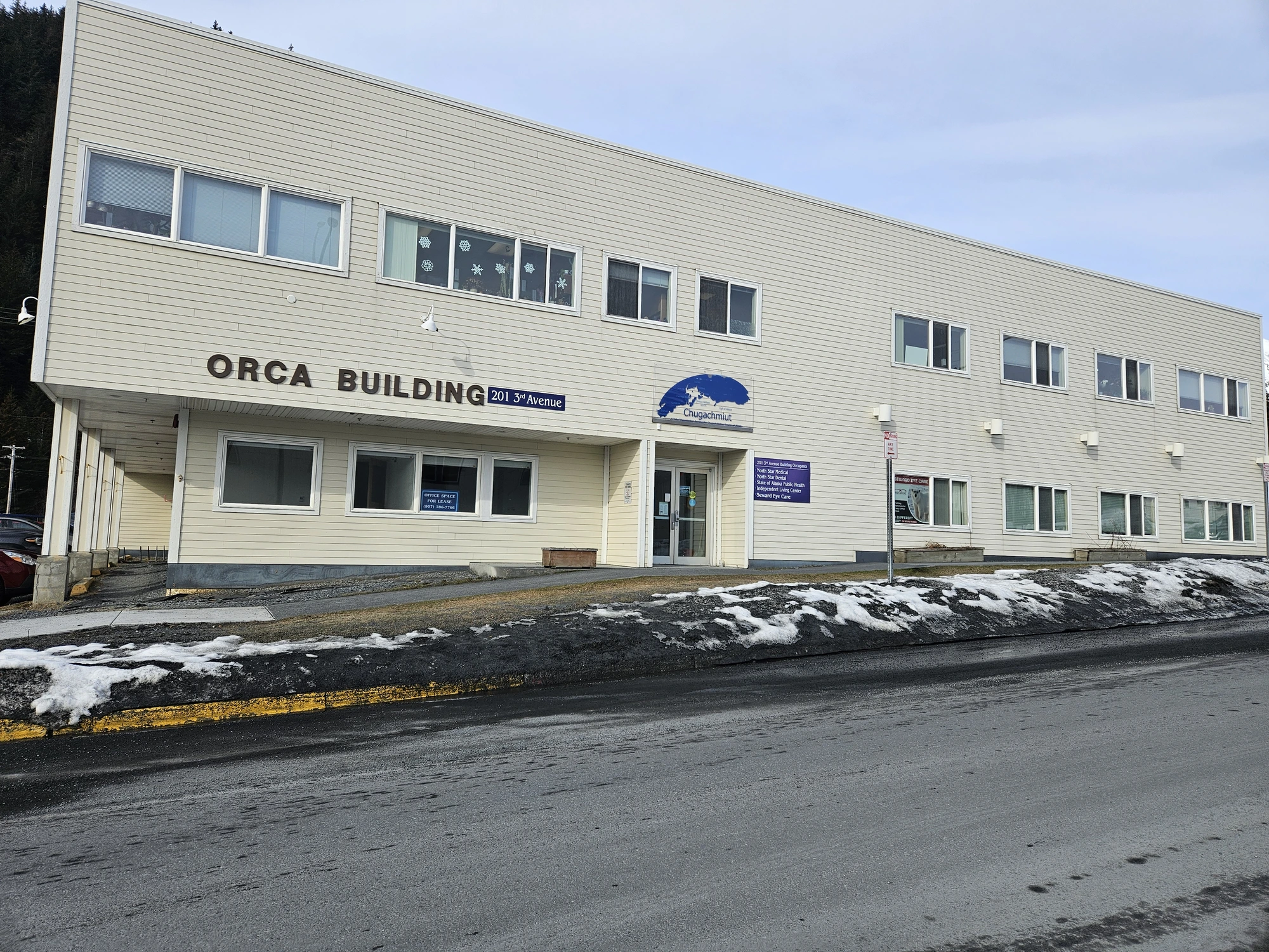 The Seward office for ILC, a white building with a sign that reads 'Orca Building'.